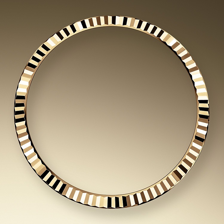 the fluted bezel oystersteel and yellow gold